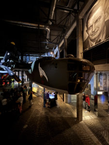 One of the main exhibition halls at the Warsaw Rising Museum. People and their stories are at the center of the museum, as shown by the numerous portraits present in this image. Photo credit: Sarah Vallejo